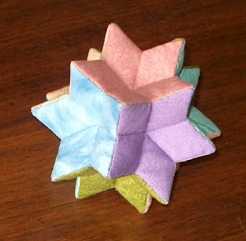 Another by Anabeth Dollins! It's a rhombic hexecontahedron--more info here!